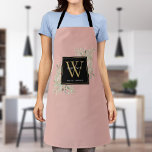 Blush Pink Watercolor Greenery Black Gold Monogram Apron<br><div class="desc">Elegant watercolor greenery leaves floral monogram name apron featuring a gold monogram initial on a blush pink background with your name set modern white typography. Designed by Thisisnotme©</div>