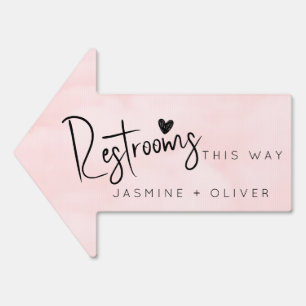 Blush pink wedding restrooms this way arrow sign