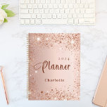 Blush rose gold glitter dust monogram name 2024 planner<br><div class="desc">A faux rose gold metallic looking background with elegant blush faux glitter dust. Personalize and add a year (upside down) and add a name. The name is written in dark rose gold with a large modern hand lettered style script with swashes. Perfect for school, work or organizing your personal/family life....</div>