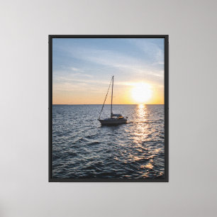 Boat Sailing into Sunset Stretched Canvas Print