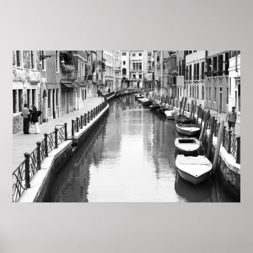 Boats along a canal in the Italian city of Venice Poster