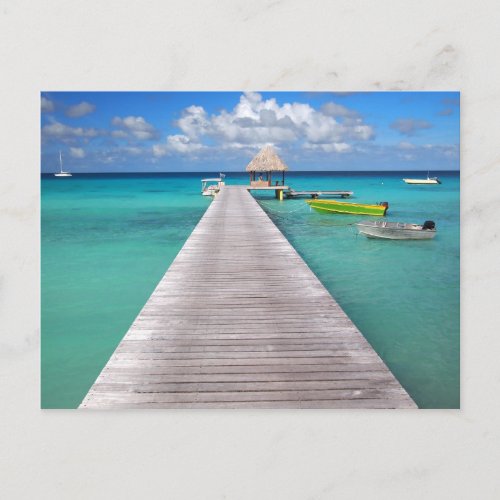 Boats at a jetty in the Pacific postcard