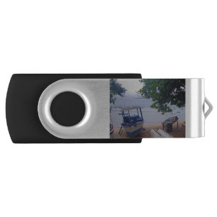 Boats stopped at the beach on a rainy day flash drive