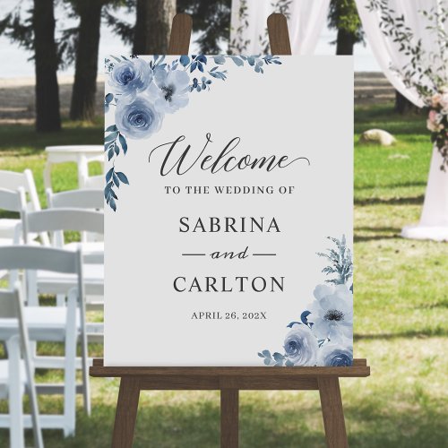 Bohemian Dusty Blue Floral Wedding Sign - Greet your guests in style with this stunning Dusty Blue Floral Wedding Welcome Sign. This sign is a perfect blend of bohemian and chic esthetic, featuring a delicate floral design in shades of light blue. To display this poster, you can mount the poster on a foam board or a wood board to be displayed on an easel or hung on a wall. And for your convenience, it also available as a digital download for self-printing.