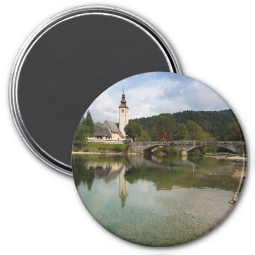 Bohinj lake with church in Slovenia round magnet