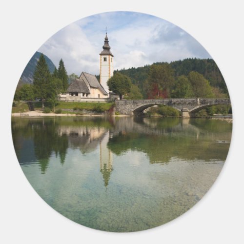 Bohinj lake with church in Slovenia round sticker