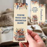 Boho Floral Reading Custom Name Bookmarks<br><div class="desc">Bring beauty and inspiration to your reading time with this boho-style floral bookmark! Featuring a vibrant bouquet of sunflowers, daisies, and wildflowers blooming around a stack of classic books, this design celebrates the joy of imagination through reading. The phrase “Reading Makes Your Imagination Bloom!” adds a cheerful and motivating touch...</div>
