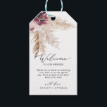 Boho Pampas Grass Wedding Welcome Gift Tags<br><div class="desc">These boho pampas grass wedding welcome gift tags are perfect for a summer wedding. The floral watercolor design features bohemian burgundy and blush pink flowers with sprigs of neutral pampas grass and golden dried palm leaves. Personalize the tags with the location of your wedding, a short welcome note, your names,...</div>