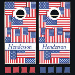 Bold American Flag Collage with Custom Name Banner Cornhole Set<br><div class="desc">This eye-catching cornhole board is bursting with patriotic pride! Featuring a dynamic collage of overlapping American flags in bold red, white, and blue, this design captures the energetic spirit of Independence Day. The vivid background draws the eye, while a blue-bordered white name panel near the bottom offers space to personalize...</div>