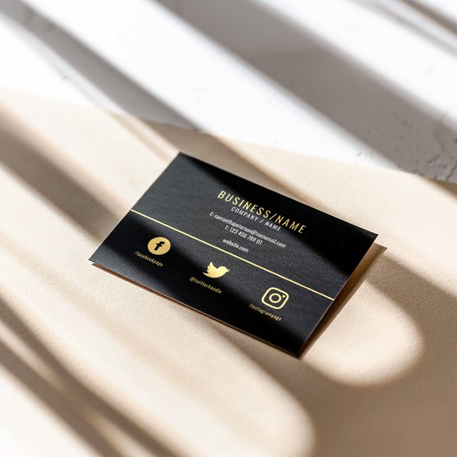Bold black and gold social media business card (Modern black business card with gold text, minimalist layout, and social media icons.)