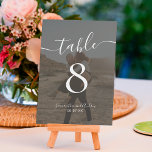 Bold black white script names photos wedding table number<br><div class="desc">Elegant black white script names chart wedding,  with a black overlay photo,  and add your photo at the back for a wedding keep sake.</div>