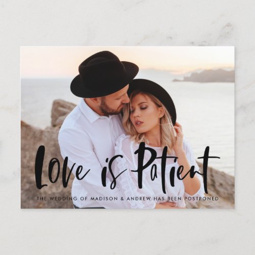 Bold Brush Script Love is Patient Postponement Announcement Postcard