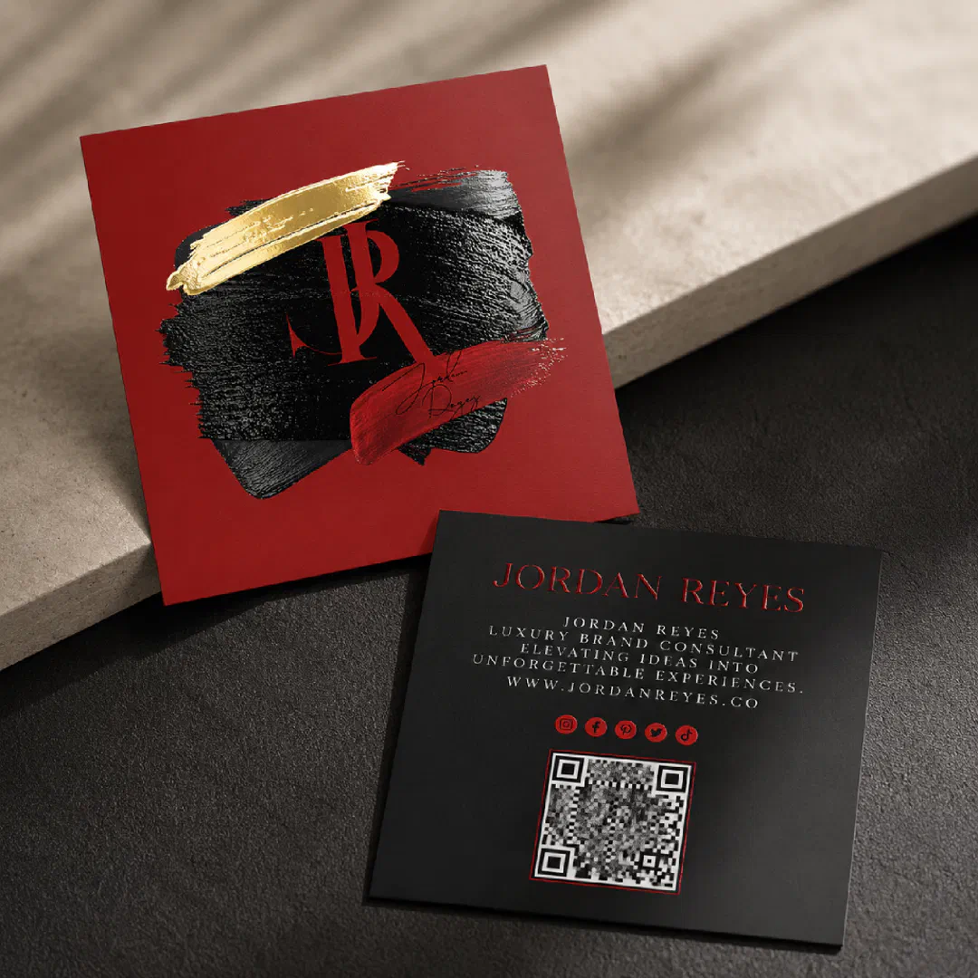 A red and black business card in a dark brown and beige background.