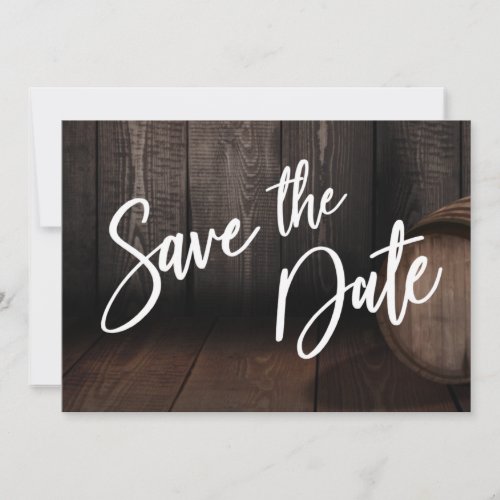 Bold Casual Typography Over Brown Wooden Barrel Save The Date