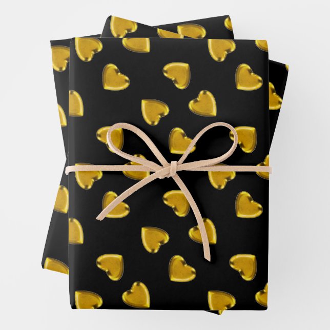 Bold gold hearts pattern black wrapping paper sheets (In situ)