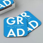 Bold Grad Blue Graduation Party Square Paper Coaster<br><div class="desc">Custom graduation paper coasters featuring "Grad" in bold white lettering with a blue background. Personalize the graduation coasters by adding the graduate's name and graduation year. The personalized graduation coasters are perfect for both high school and college graduation parties.</div>