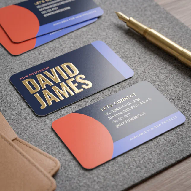 A modern, minimalist business card with rounded corners, featuring a dark navy background, a coral-orange circular accent, and gold foil typography.