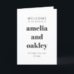 Bold Modern Minimalist Black White Wedding Program<br><div class="desc">Welcome guests to your wedding day with this beautifully designed black and white folded program that combines simplicity and sophistication. The elegant cover features customizable names and event details in a bold typography, while the inside includes a preformatted template to outline your ceremony and wedding party details. The back is...</div>