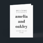 Bold Modern Minimalist Black White Wedding Program<br><div class="desc">Welcome guests to your wedding day with this beautifully designed black and white folded program that combines simplicity and sophistication. The elegant cover features customizable names and event details in a bold typography, while the inside includes a preformatted template to outline your ceremony and wedding party details. The back is...</div>