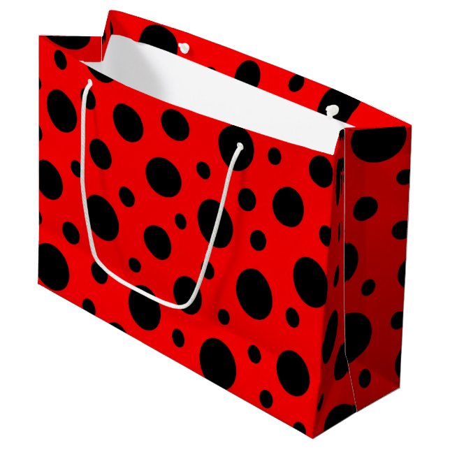 Large gift bag decorated with bold red and black polka dots