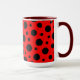 Mug featuring a red and black polka dot pattern