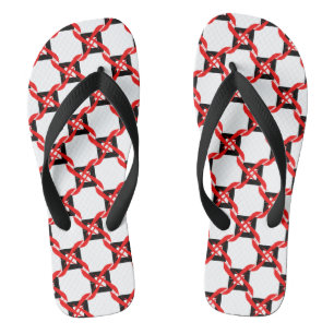 Bold red, black, and white graphic pinwheel flip flops