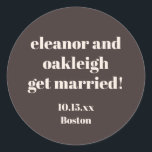Bold Typography Warm Brown Modern Wedding Custom Classic Round Sticker<br><div class="desc">This personalized wedding sticker in brown features bold modern typography with a warm,  minimalist layout. Customize the names,  date,  and location to match your celebration details. A versatile option for wedding favors,  envelopes,  welcome bags,  and day-of decor. Designed to coordinate seamlessly with modern and neutral wedding styles.</div>