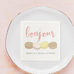 Bonjour French Macarons Bridal Shower Paper Napkins<br><div class="desc">Bonjour! Add a touch of Parisian style to your bridal shower with these pretty cocktail napkins. Design features four delicious French macaron illustrations in pastel pink, ivory, tan and pale yellow, with "Bonjour" in peachy pink handwritten style script lettering. Customize with the guest of honor's name for a personalized touch....</div>