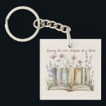 Book Lover Gift with Floral and Book Stack Design Keychain<br><div class="desc">Celebrate your love for books with this Living Life One Chapter at a Time Acrylic Keychain featuring a charming stack of books surrounded by soft, delicate flowers. Perfect for readers, bookworms, and literature lovers, this lightweight and durable acrylic keychain makes a thoughtful accessory for backpacks, purses, or keys. With its...</div>