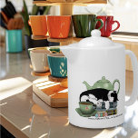 Books Cat Tea Cute Teapot<br><div class="desc">A cute black and white cat sleeping on a pile of books with a green teapot and a cup of tea.</div>