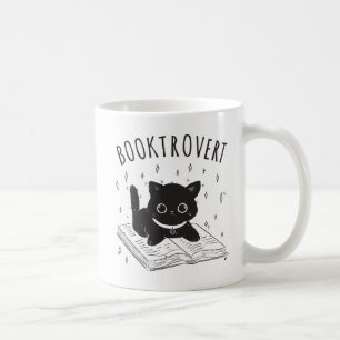 Booktrovert cat with book and stars coffee mug