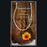 Boots, Daisy and Horse Bit Congratulations Wedding Small Gift Bag<br><div class="desc">Fill the charming Cowboy Boots, Daisy and Horse Bit Congratulations Country Wedding Gift Bags with your present for the newlyweds. These charming custom equine theme wedding congrats bags feature a quaint digitally enhanced floral photograph of a pair of brown leather western cowboy boots, a yellow orange daisy flower blossom, horse...</div>