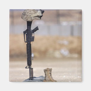 Boots, rifle, dog tags, and protective helmet magnet