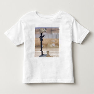 Boots, rifle, dog tags, and protective helmet toddler t-shirt