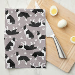 Border Collie and Paw Print Kitchen Towel<br><div class="desc">Cute black and white border collies sit,  stay and rollover on a gray background with pawprints,  a fun dog themed pattern.</div>
