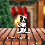 Border Collie Christmas Pet Ornament<br><div class="desc">Adorable,  black/white Border Collie cartoon graphic wearing a red/white Santa Claus hat,  and has pink tongue out.



Graphic by:  Lori@SaltTownStudio</div>