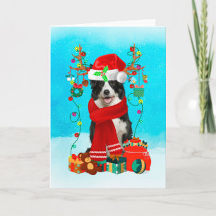 Border Collie in snow with Christmas gifts Card