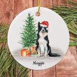 Border Collie Santa Dog Personalized Christmas Ceramic Ornament<br><div class="desc">Decorate your tree or give a special gift this holiday season with this border collie santa dog christmas ornament, and matching decor. This border collie christmas ornament features a watercolor dog in a santa hat and tree. Personalize with name front, year back. This border collie christmas ornament will be a...</div>