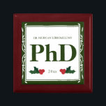 Border Green Holly Name Year PhD Graduation Gift Box<br><div class="desc">A square Phd graduation keepsake box with a Christmas feel. The top has a decorative border and a holly berry and leaf accents. It has a green and white color scheme and shows the degree, name, and year. Simply customize this box, add it to your cart, and give it to...</div>