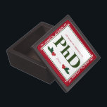 Border Red Holly Name Year PhD Graduation Gift Box<br><div class="desc">A square Phd graduation keepsake magnetic box with a Christmas feel. The top has a decorative border and a holly berry and leaf accents. It has a red, green, and white color scheme and shows the degree, name, and year. Simply customize this box, add it to your cart, and give...</div>