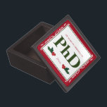 Border Red Holly Name Year PhD Graduation Gift Box<br><div class="desc">A square Phd graduation keepsake magnetic box with a Christmas feel. The top has a decorative border and a holly berry and leaf accents. It has a red, green, and white color scheme and shows the degree, name, and year. Simply customize this box, add it to your cart, and give...</div>