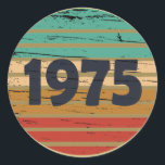 Born in 1975 vintage 50th birthday party classic round sticker<br><div class="desc">Make your birthday special with this unique design. Add a touch of sophisticated elegance to your birthday celebration with our exquisite, one-of-a-kind designs. These graphics bring sophistication and originality to any product, creating a memorable and stylish gift. They are perfect for those who appreciate a touch of timeless glamour on...</div>