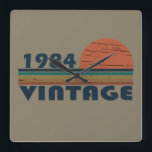 born in 1984 vintage birthday square wall clock<br><div class="desc">You can add some originality to your wardrobe with this original 1983 vintage sunset retro-looking birthday design with awesome colors and typography font lettering, is a great gift idea for men, women, husband, wife girlfriend, and a boyfriend who will love this one-of-a-kind artwork. The best amazing and funny holiday present...</div>