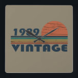 born in 1989 vintage birthday square wall clock<br><div class="desc">You can add some originality to your wardrobe with this original 1989 vintage sunset retro-looking birthday design with awesome colors and typography font lettering, is a great gift idea for men, women, husband, wife girlfriend, and a boyfriend who will love this one-of-a-kind artwork. The best amazing and funny holiday present...</div>