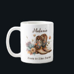 Born to Line Dance Cowboy Floral Boots Coffee Mug<br><div class="desc">Add a rustic charm to your wardrobe with this unique cowboy floral coffee mug. Featuring classic cowboy boots adorned with delicate boho-style flowers in earthy tones, this coffee mug captures the spirit of the Wild West with a modern, artistic twist. Perfect for personalizing with your special girl's name, this mug...</div>