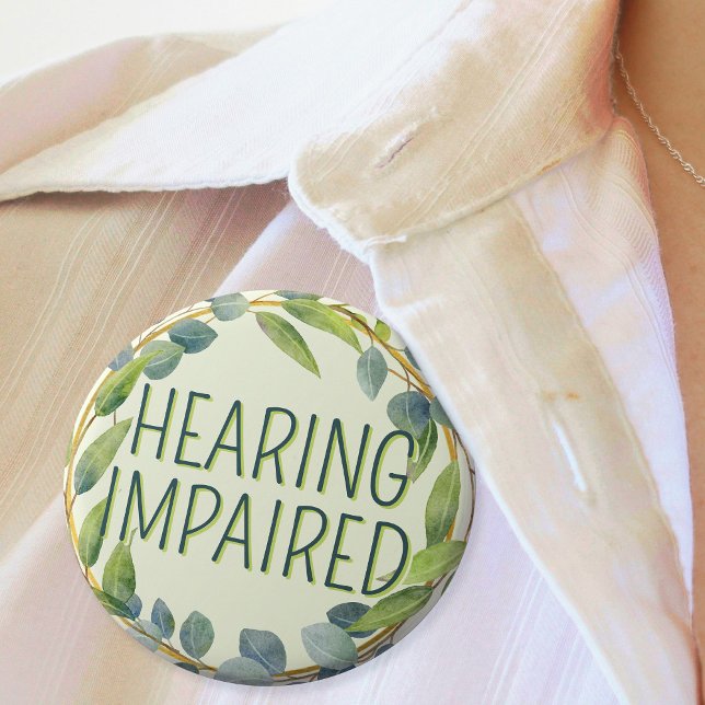 Botanical Green Leaves Hearing Impaired Button (In Situ. Badge with green leaves border and narrow text that says Hearing Impaired.)
