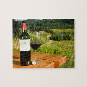 Bottle of red wine and glass on table jigsaw puzzle