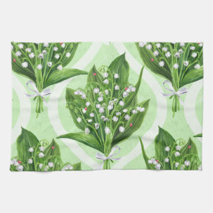 Bouquet of lilly of the valley flowers on green kitchen towel