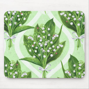Bouquet of lilly of the valley flowers on green mouse pad