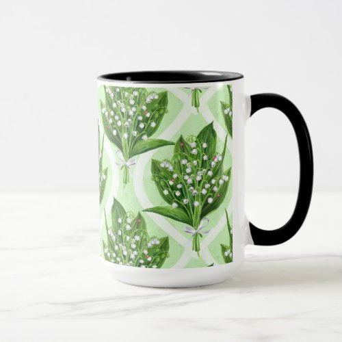 Bouquet of lilly of the valley flowers on green mug